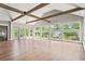 Spacious living room boasting wood beams, hardwood floors and an abundance of large windows at 3597 Sunfish St., Murrells Inlet, SC 29576