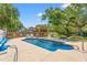 Backyard pool area features a pool, chairs for lounging, and a gazebo with rocking chairs at 3597 Sunfish St., Murrells Inlet, SC 29576