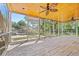 Spacious screened porch with wood ceiling, ceiling fans, and views of the backyard pool at 3597 Sunfish St., Murrells Inlet, SC 29576