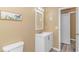 Bright bathroom with vanity and framed mirror at 3700 Golf Colony Lane # 25-D, Little River, SC 29566