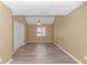 Spacious bedroom with a large window, carpet flooring, and ample closet space at 3700 Golf Colony Lane # 25-D, Little River, SC 29566