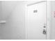 Close up of the unit entrance featuring a white door with black numbering on a white wall at 3700 Golf Colony Lane # 25-D, Little River, SC 29566