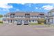 Charming townhouse with blue siding, a gray roof, and convenient parking in front at 3700 Golf Colony Lane # 25-D, Little River, SC 29566