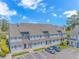 Exterior of condo building with cars parked out front at 3700 Golf Colony Lane # 25-D, Little River, SC 29566