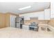 Well-lit kitchen featuring granite countertops, stainless steel appliances, and ample storage space at 3700 Golf Colony Lane # 25-D, Little River, SC 29566