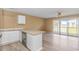 A view from the kitchen, with a sliding glass door leading to the outside in the background at 3700 Golf Colony Lane # 25-D, Little River, SC 29566