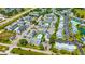 Expansive aerial view of condos with parking, greenery, and convenient highway access at 3700 Golf Colony Lane # 2-J, Little River, SC 29566