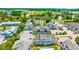 A stunning aerial shot of the complex shows mature landscaping, ample parking, and well-maintained building exteriors at 3700 Golf Colony Lane # 2-J, Little River, SC 29566