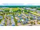 Overhead shot shows condo exteriors, pool, and parking lots nestled among trees, with easy access to nearby commercial areas at 3700 Golf Colony Lane # 2-J, Little River, SC 29566