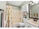 Cozy bathroom features a shower-tub combo, neutral curtain, and functional vanity at 3700 Golf Colony Lane # 2-J, Little River, SC 29566