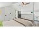 Bright bedroom with vaulted ceiling, ceiling fan, and loft area with shelves at 3700 Golf Colony Lane # 2-J, Little River, SC 29566