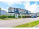 Charming condo exterior featuring well-manicured landscaping and ample parking space at 3700 Golf Colony Lane # 2-J, Little River, SC 29566
