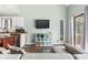 Cozy living room with TV and access to the kitchen creates a comfortable entertaining space at 3700 Golf Colony Lane # 2-J, Little River, SC 29566