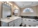 Bright bathroom with double vanity, soaking tub, and classic finishes at 391 William Nobles Rd., Aynor, SC 29511