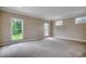 Spacious bedroom with carpet flooring, multiple windows, and neutral paint at 391 William Nobles Rd., Aynor, SC 29511