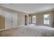 Large bedroom featuring carpet, windows, closets, and neutral walls at 391 William Nobles Rd., Aynor, SC 29511