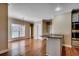 Light-filled dining area with a breakfast bar, hardwood floors, and stainless-steel appliances at 391 William Nobles Rd., Aynor, SC 29511