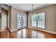 Bright and airy dining area featuring French doors, hardwood floors, and a chandelier at 391 William Nobles Rd., Aynor, SC 29511