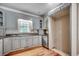 Bright kitchen with grey cabinets, granite countertops, and natural light at 391 William Nobles Rd., Aynor, SC 29511