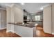 Charming kitchen featuring grey cabinets, granite countertops, and stainless steel appliances at 391 William Nobles Rd., Aynor, SC 29511