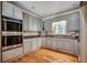 This kitchen showcases lovely grey cabinets, granite countertops, and stainless steel appliances at 391 William Nobles Rd., Aynor, SC 29511