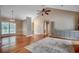 The large living room is brightened by natural light, hardwood floors, and updated lighting fixtures at 391 William Nobles Rd., Aynor, SC 29511