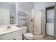 Bathroom with walk-in shower, vanity, and washer dryer at 3951 Gladiola Ct. # 104, Myrtle Beach, SC 29588