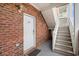 Brick entryway with white door and stairs leading to upper levels at 3951 Gladiola Ct. # 104, Myrtle Beach, SC 29588