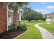 Manicured community with a lake fountain, palm tree, beautiful landscaping and walkways at 3951 Gladiola Ct. # 104, Myrtle Beach, SC 29588