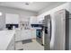 Modern kitchen with stainless steel appliances, white cabinets, and ample countertop space at 3951 Gladiola Ct. # 104, Myrtle Beach, SC 29588