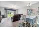 Open-concept living and dining area with comfortable seating, bright natural light, and stylish decor at 3951 Gladiola Ct. # 104, Myrtle Beach, SC 29588