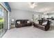 Spacious living room with neutral walls, plush sofas, and lots of natural light at 3951 Gladiola Ct. # 104, Myrtle Beach, SC 29588