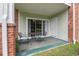 Private patio with chairs and a table perfect for outdoor relaxation and entertaining guests at 3951 Gladiola Ct. # 104, Myrtle Beach, SC 29588