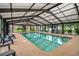 Indoor pool for year-round enjoyment, featuring ample lounge chairs and natural light at 3951 Gladiola Ct. # 104, Myrtle Beach, SC 29588