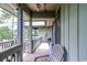 Relax on this outdoor porch area, equipped with seating, providing a perfect spot to enjoy the surrounding natural scenery at 404 72Nd Ave. N # 301, Myrtle Beach, SC 29572