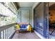 Relaxing covered balcony with outdoor seating, plants, and sliding glass door to the living area at 404 72Nd Ave. N # 301, Myrtle Beach, SC 29572