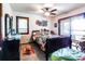 A cozy bedroom featuring a queen bed, ceiling fan, bureau, and other furniture at 404 72Nd Ave. N # 301, Myrtle Beach, SC 29572