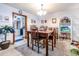 Cozy dining area with wood table set, vintage decor, and fish tank at 404 72Nd Ave. N # 301, Myrtle Beach, SC 29572