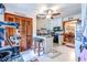 A cozy kitchen featuring white tile flooring, seating at the bar, and a ceiling fan at 404 72Nd Ave. N # 301, Myrtle Beach, SC 29572
