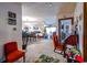 Spacious living area with neutral carpeting, seamlessly connecting the living room, dining area, and a cozy seating area at 404 72Nd Ave. N # 301, Myrtle Beach, SC 29572