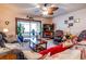 Inviting living room featuring a ceiling fan, large TV, and comfortable seating, creating a cozy atmosphere for relaxation at 404 72Nd Ave. N # 301, Myrtle Beach, SC 29572
