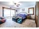 Comfortable bedroom with large windows and closet, ceiling fan, and neutral carpet at 404 72Nd Ave. N # 301, Myrtle Beach, SC 29572