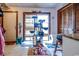 A view of the mud room, with tile floors, blinds, a cat tree, and some decorations at 404 72Nd Ave. N # 301, Myrtle Beach, SC 29572