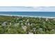 Aerial view of neighborhood, close to beach, mature trees, and surrounding homes at 412 Middleton Dr., Pawleys Island, SC 29585