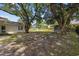 Expansive backyard with mature trees, storage shed, and partial fencing at 412 Middleton Dr., Pawleys Island, SC 29585