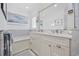 Bright bathroom featuring a marble tile, double sinks, and a soaking tub at 412 Middleton Dr., Pawleys Island, SC 29585