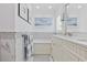 Bright bathroom featuring a marble tile and double sinks at 412 Middleton Dr., Pawleys Island, SC 29585