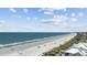 Beach view showing the beach, ocean, boardwalk, and surrounding condos at 412 Middleton Dr., Pawleys Island, SC 29585