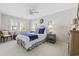Comfortable bedroom featuring a ceiling fan, blue accents, and ample natural light at 412 Middleton Dr., Pawleys Island, SC 29585