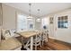 Cozy breakfast nook with a built-in bench, wood table, and modern pendant lighting at 412 Middleton Dr., Pawleys Island, SC 29585